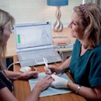 Female Client getting a Bio-Energetic Assessment