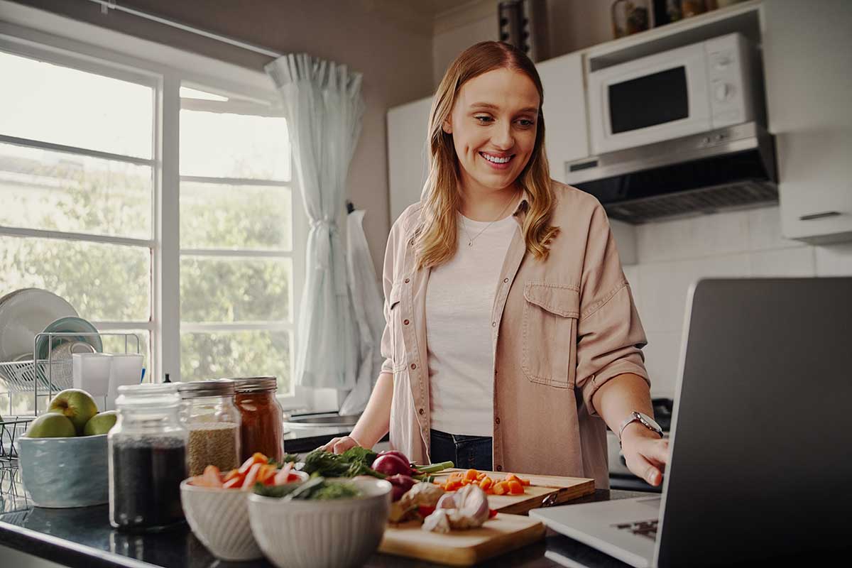 woman cooking during a virtual cooking workshop with destiny wellness