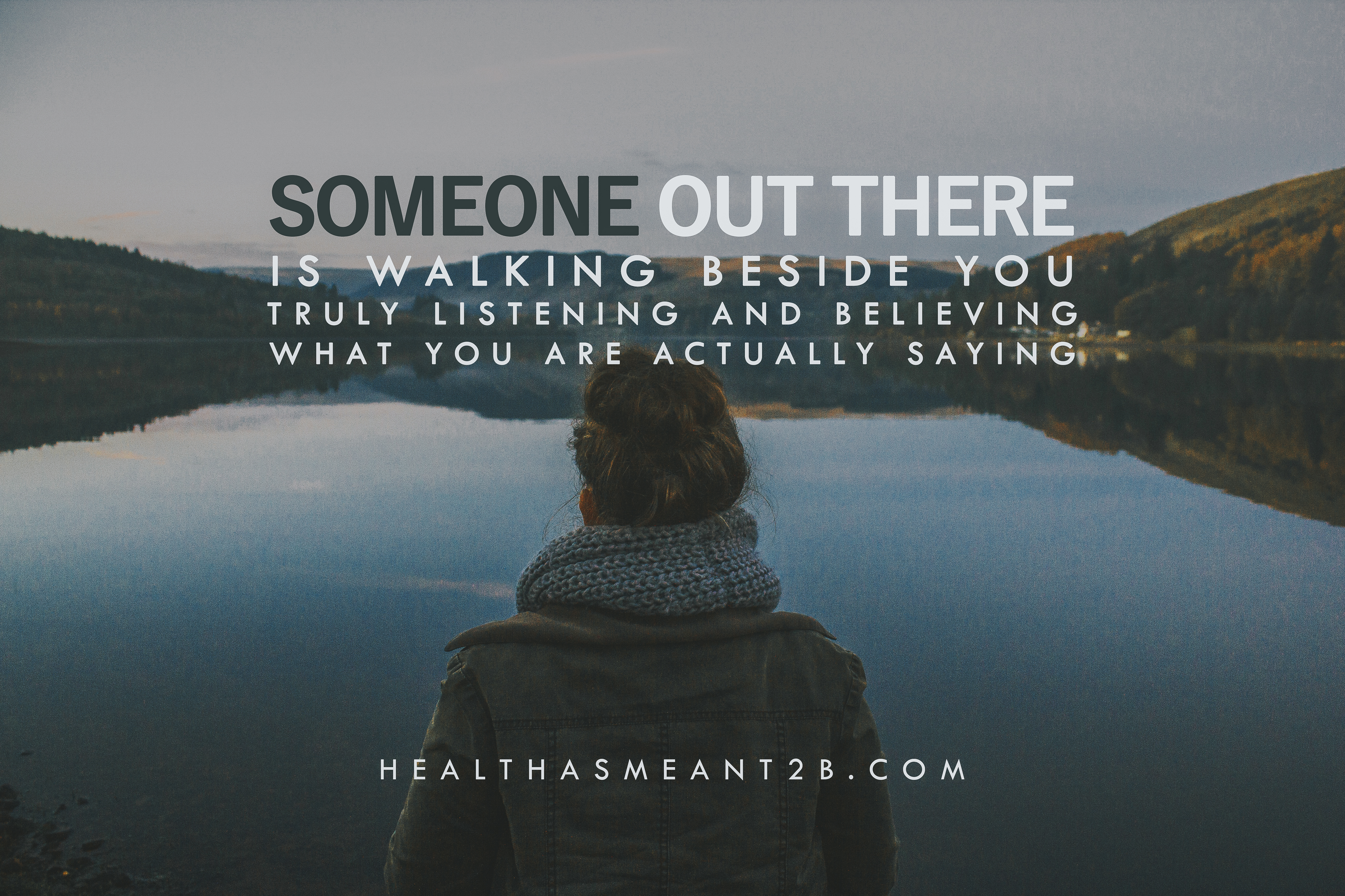 Inspirational woman sitting near water