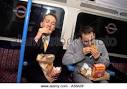 Men eating on subway