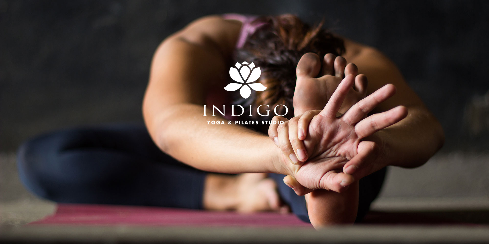 woman stretching for yoga at indigo yoga & pilates