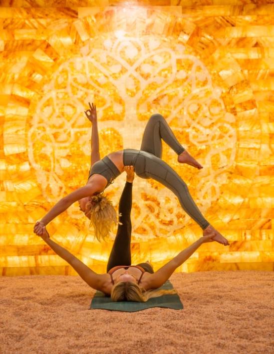 2 women doing yoga at the Himalayan salt cave at purify wellness center in pleasant grove, ut