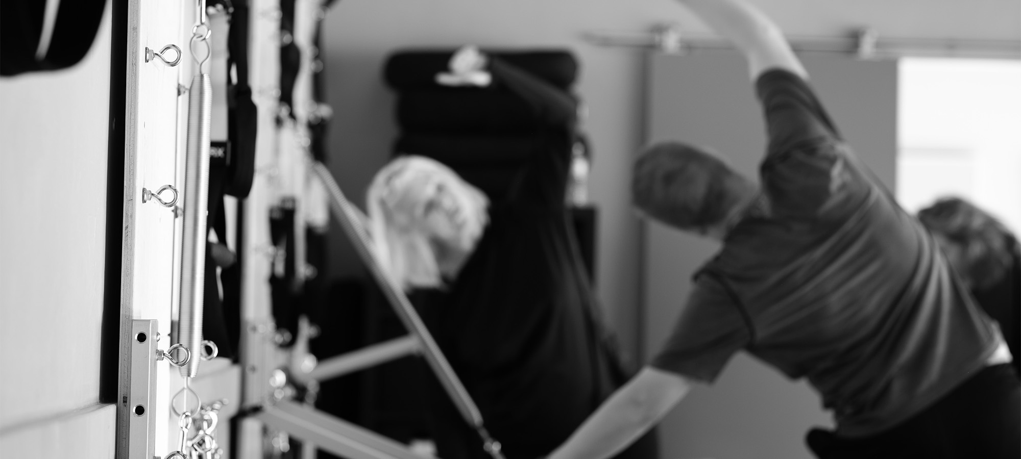 Group doing Pilates in a studio