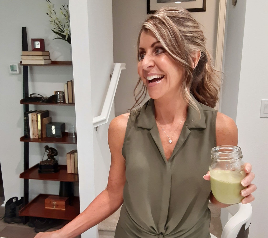 Cheryl mothes with a green smoothie
