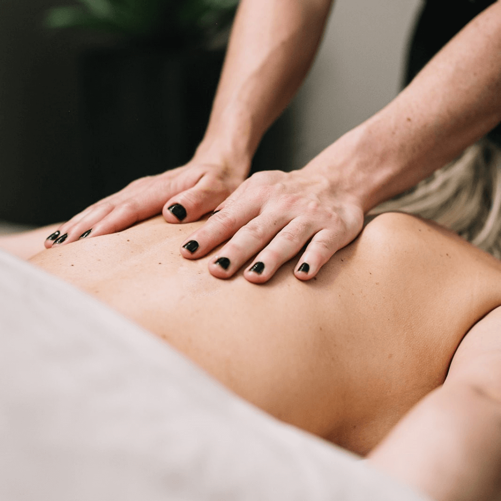 person receiving a back massage at spa sway in austin texas