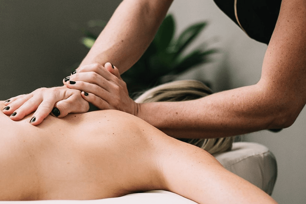 woman getting a deep tissue massage at spa sway in austin texas