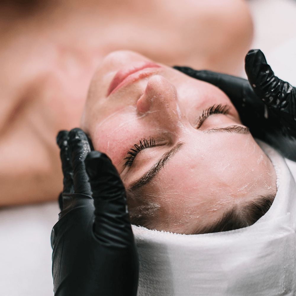 woman receiving facial cleanse at spa sway in austin texas