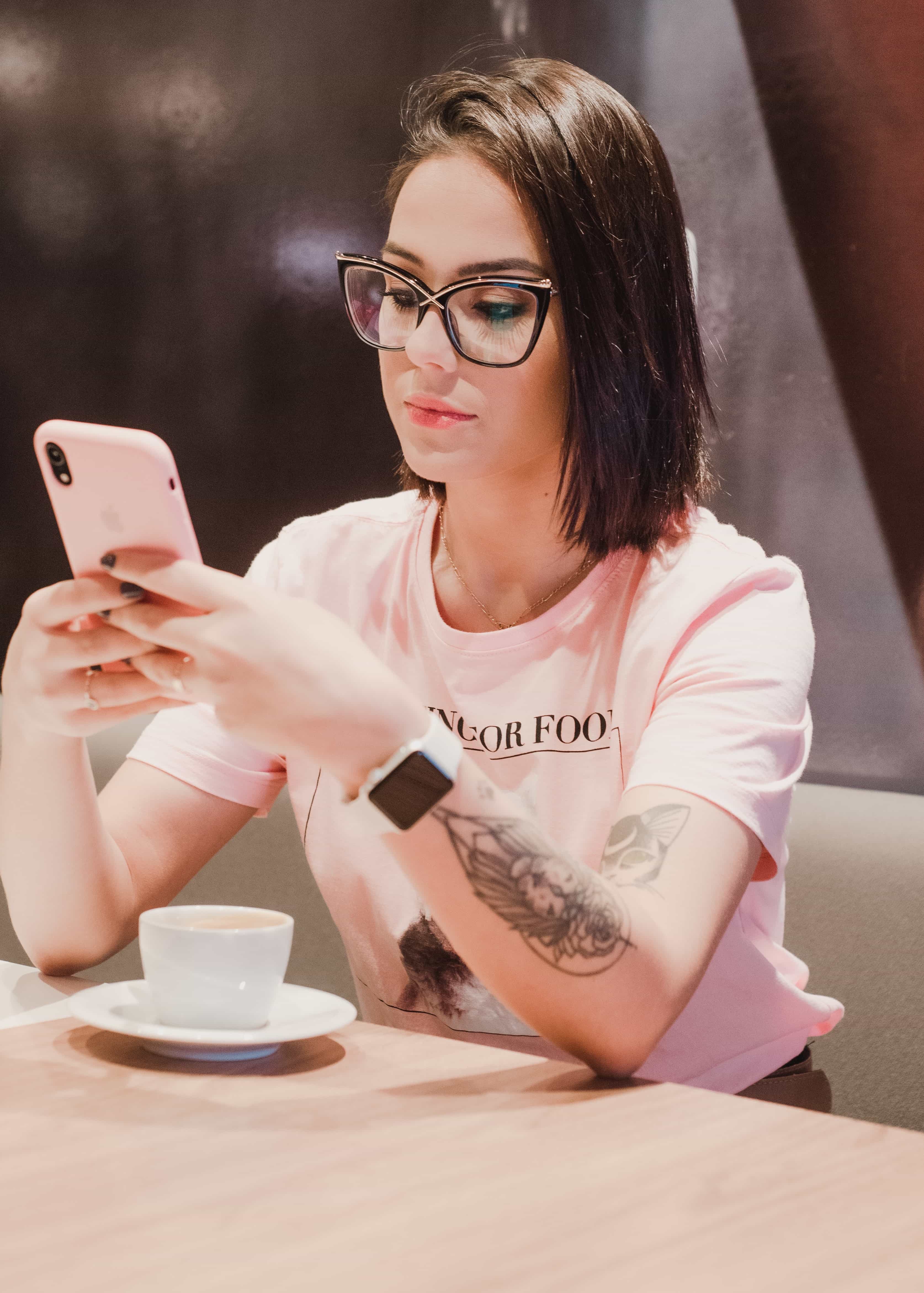 woman using a smartphone to book online classes