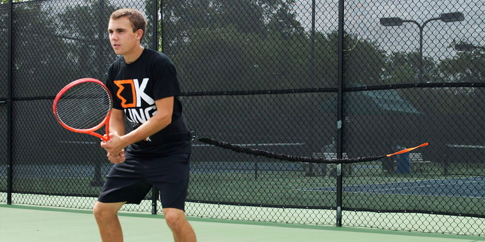 male playing tennis