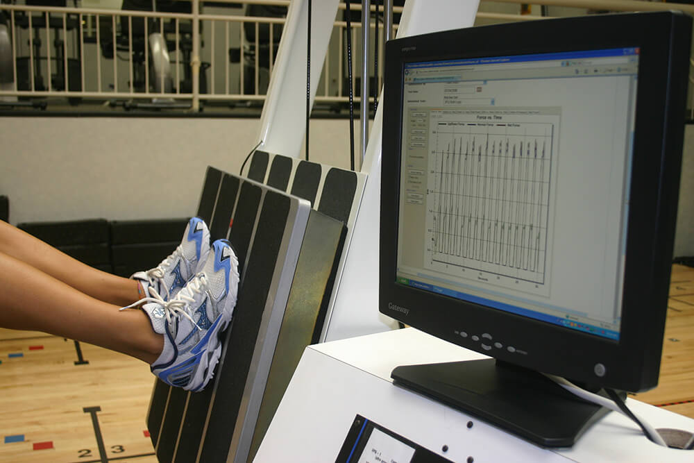 girl working out on 3PQ machine at athletic republic