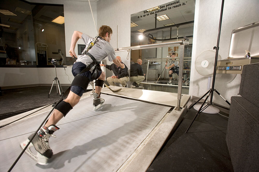Man working out on hockey treadmill at athletic republic