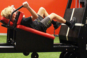 girl working out on Plyo Press Machine at athletic republic