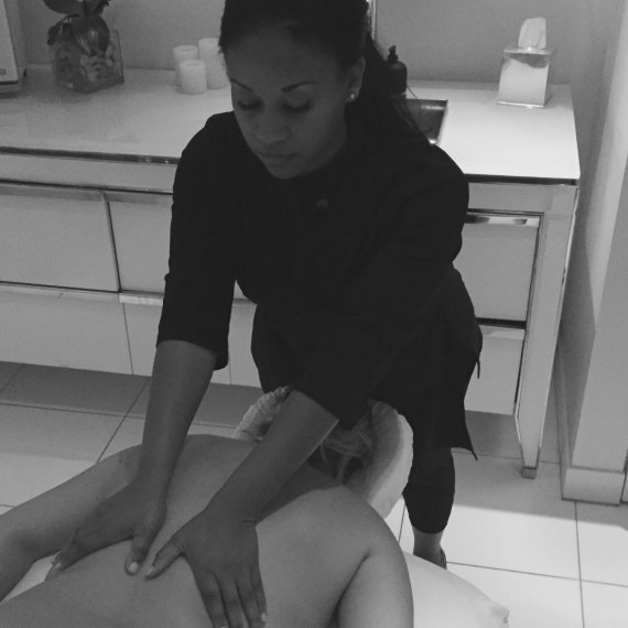 Lisa Dean, owner of Body Nourishment Wellness Spa in Beverly Hills, massaging a client