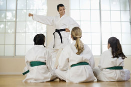 Students Learning From Their Instructor During a Junior Karate Class
