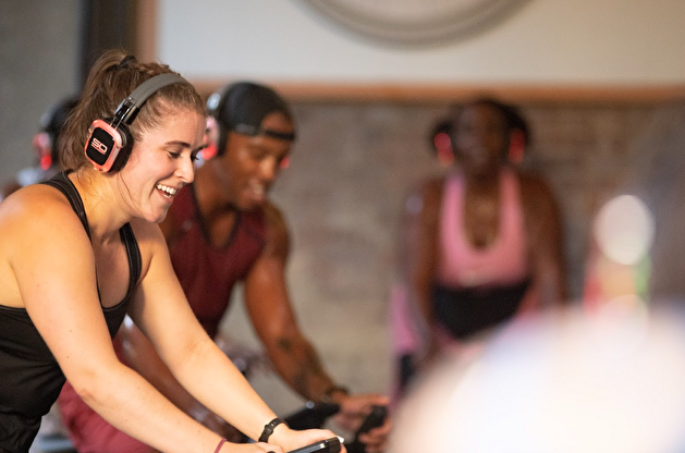 4 people wearing byklyn cycling studio merchandise
