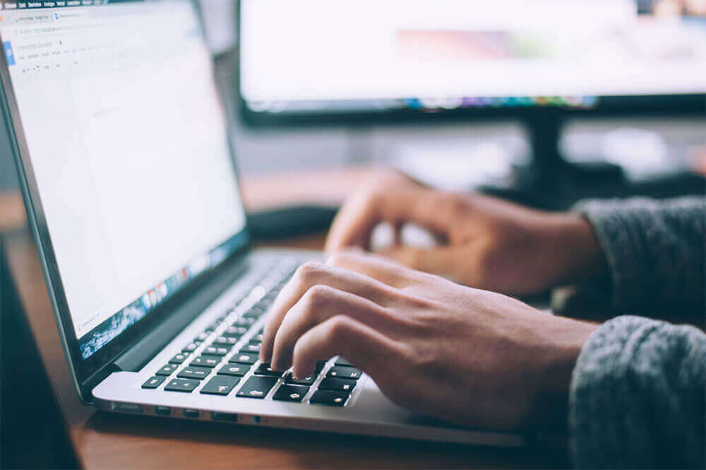 typing-on-mac-laptop
