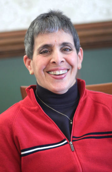 Christine Boutross Photo, smiling wearing a red sweater