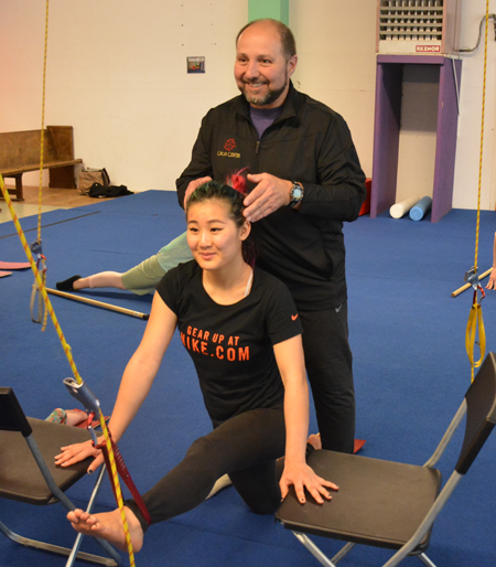 Teacher adjusts head position of student during Physical Limitation Elimination class | Circus Center | San Francisco
