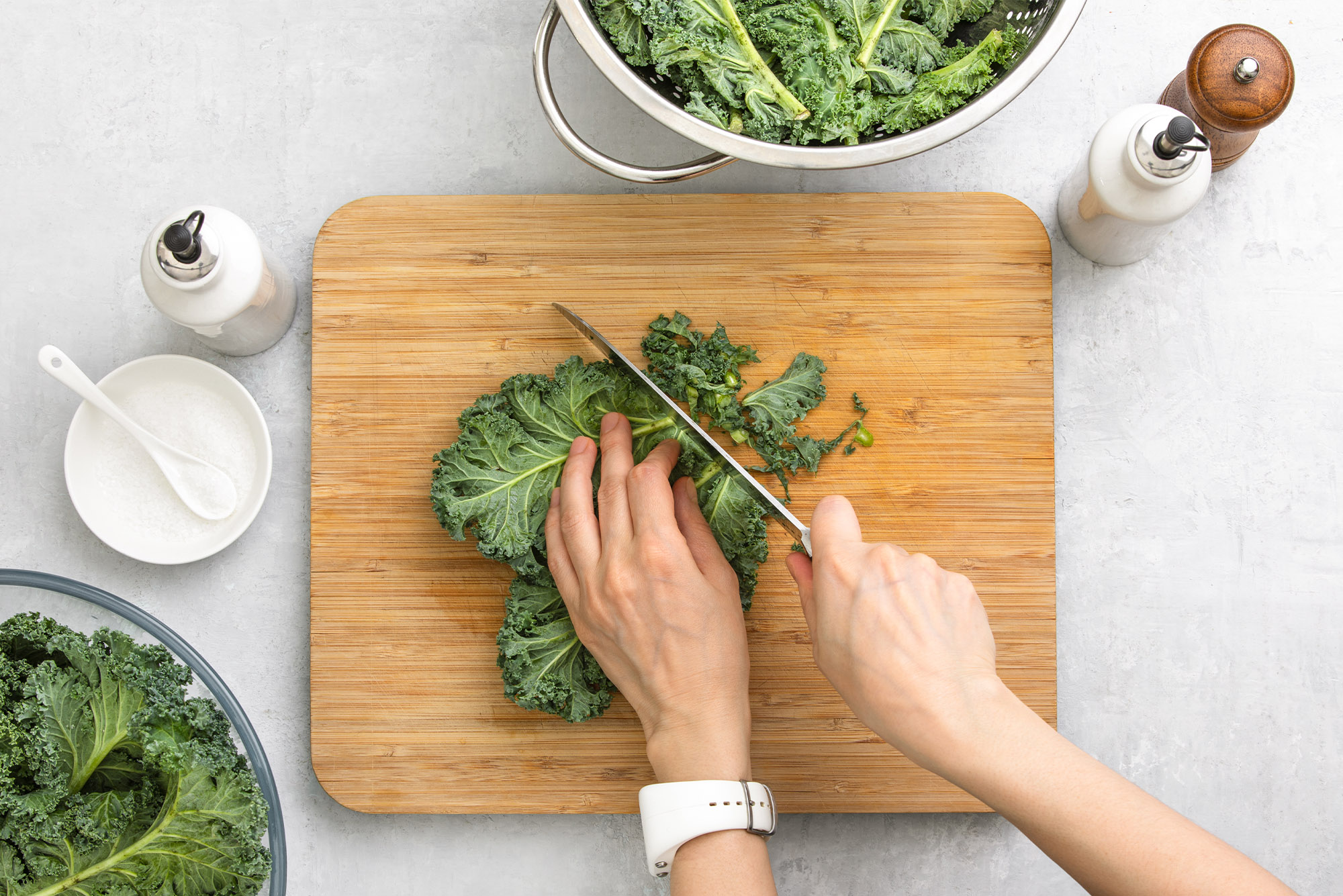 person cutting kale for a healthy recipe