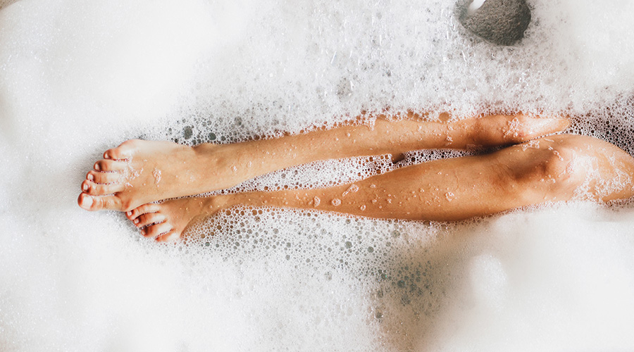 legs in bubbly bathtub