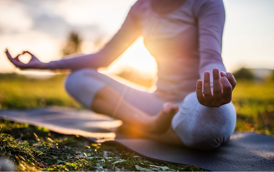 Woman doing yoga outdoors