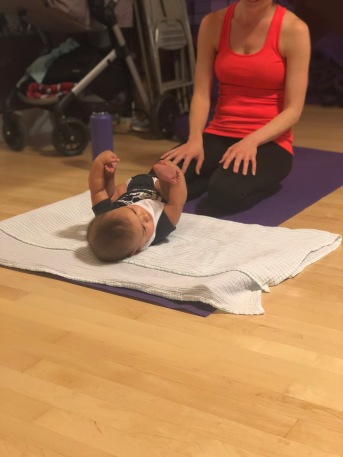 Postpartum yoga class in session at CocoonCare in Chicago, IL