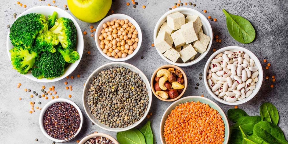 bowls of veggies, nuts, and seeds