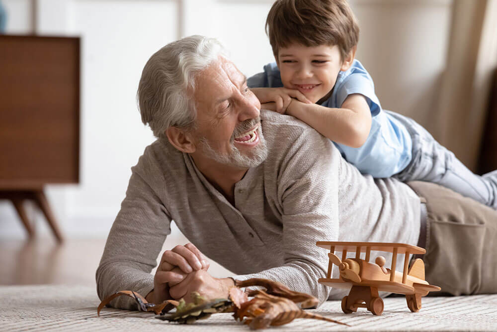 grandpa-playing-toys-with-grandson