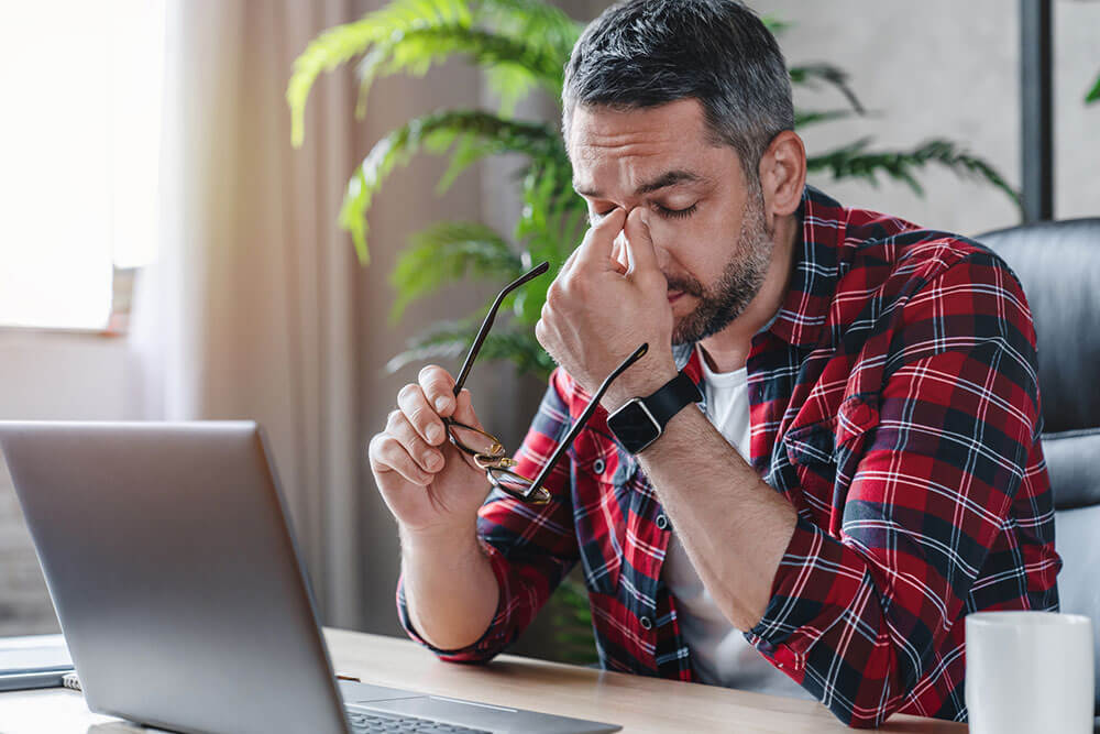 man-tired-at-desk