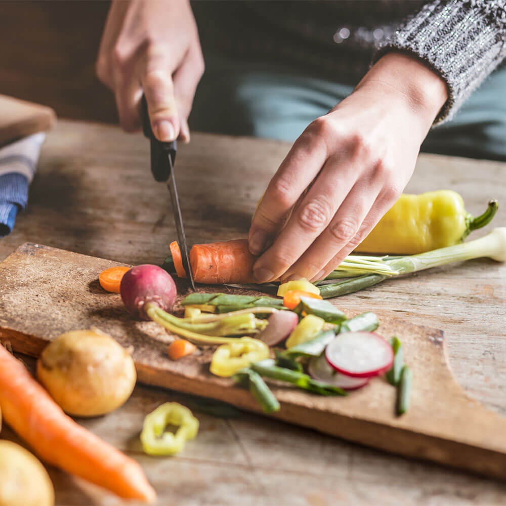 woman-cutting-carrots