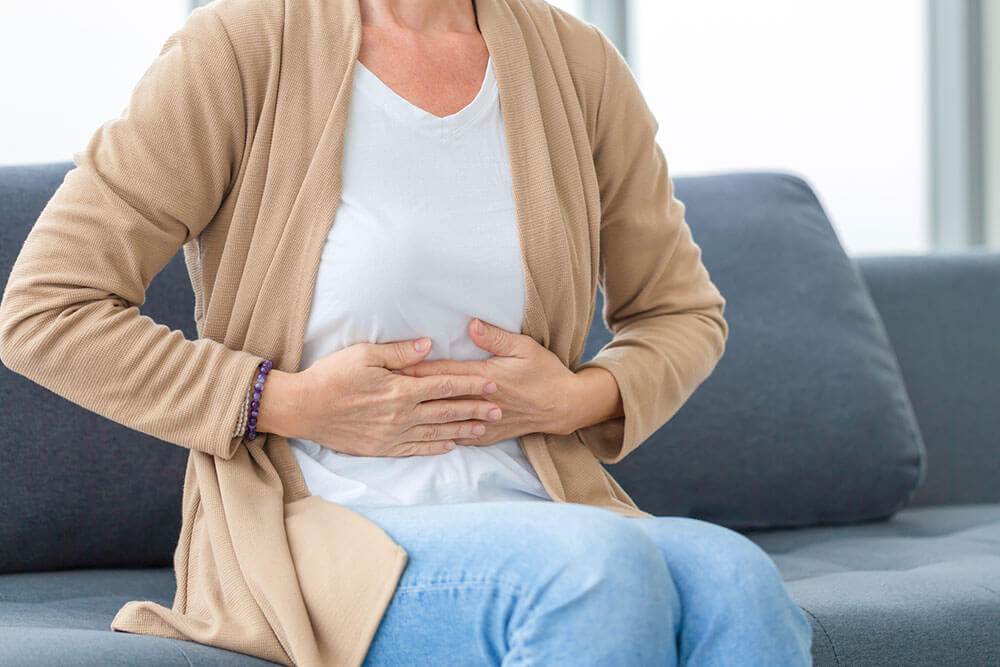 woman-holding-stomach-ache