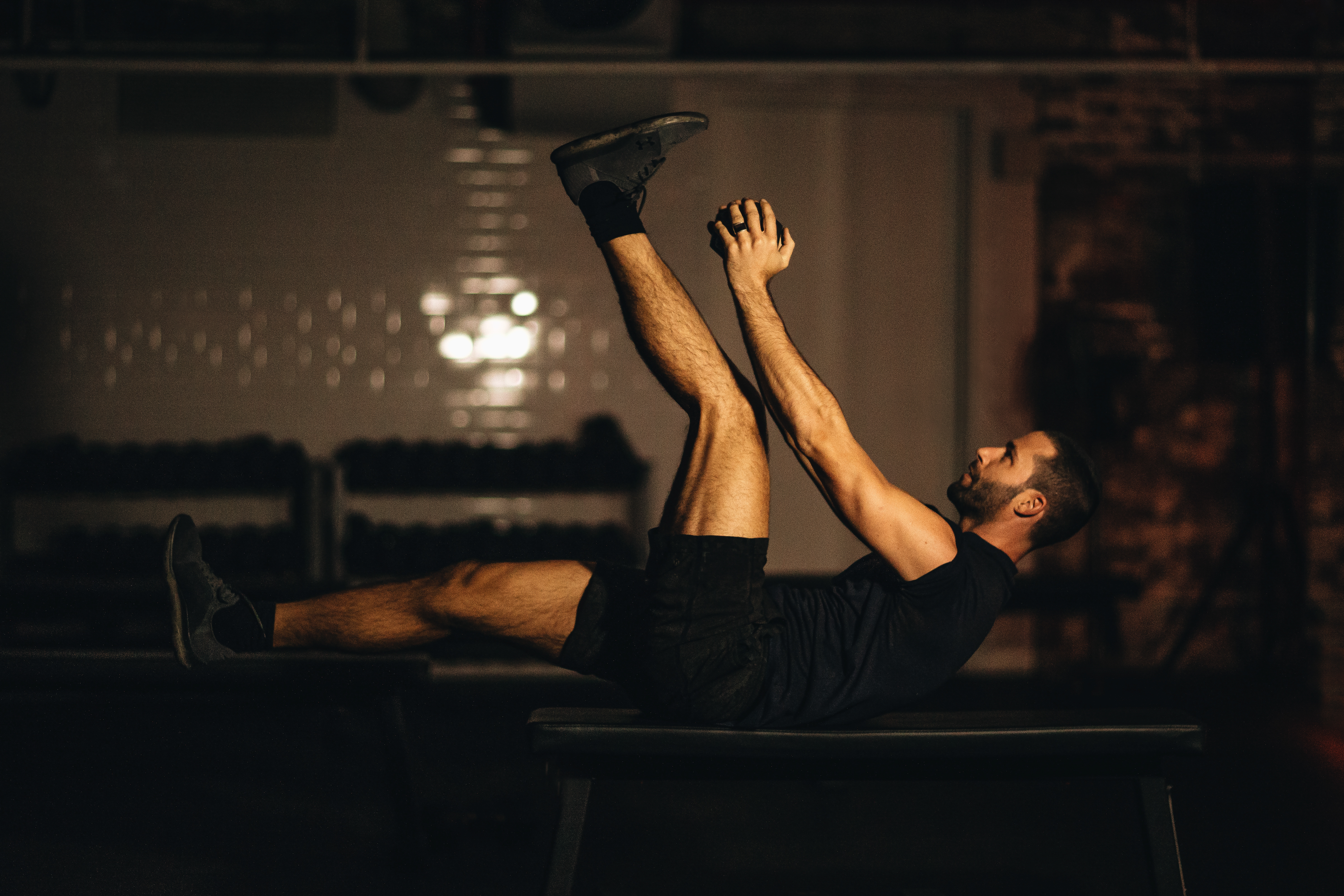 man doing weight workout on bench