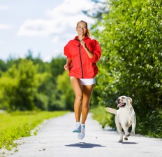 woman-running-with-her-dog-232x224