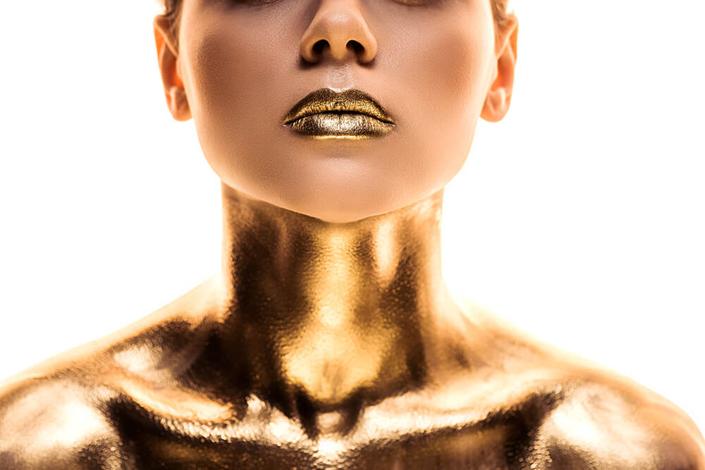 woman with gold lips and body