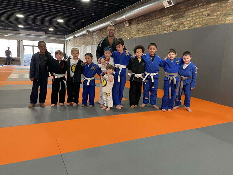 Group of Double Five BJJ instructor and kids