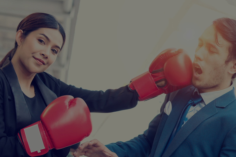 corporate woman with boxing gloves