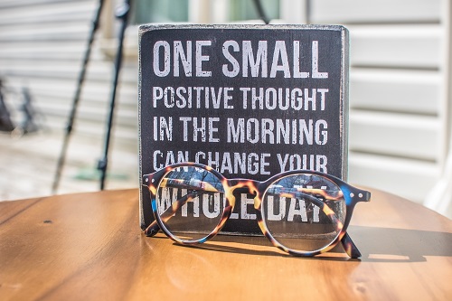 a sign promoting one positive thought each day 