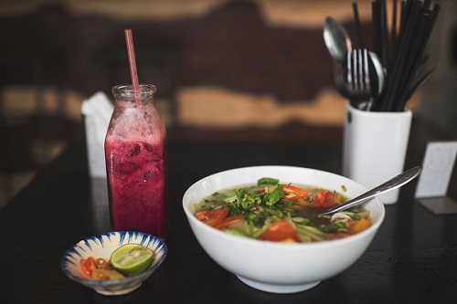 bowl of vegetable soup with a fruit smoothie - elimination diet_copy