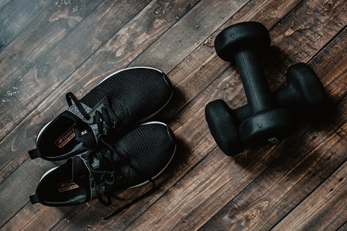 running shoes and dumb bells