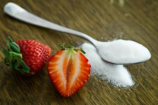 spoonful of sugar next to strawberries