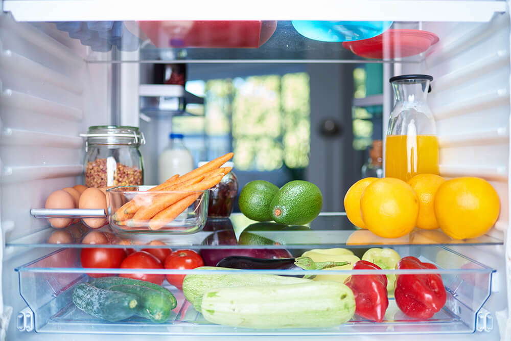 fruits and vegetables in fridge in leora's kitchen