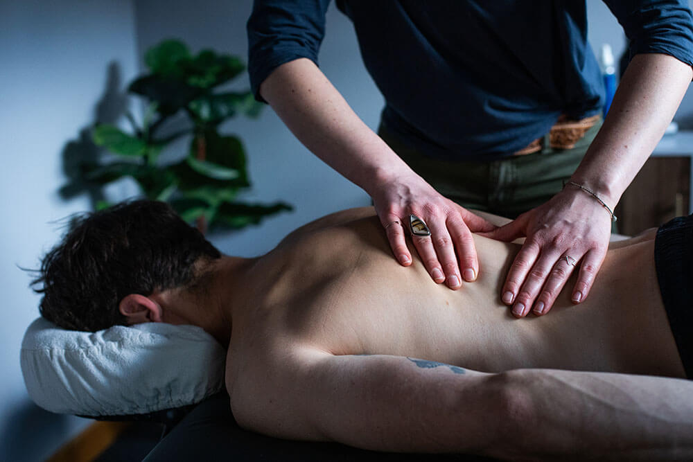 man getting a back massage at medicine wheel wellness in jackson, wy
