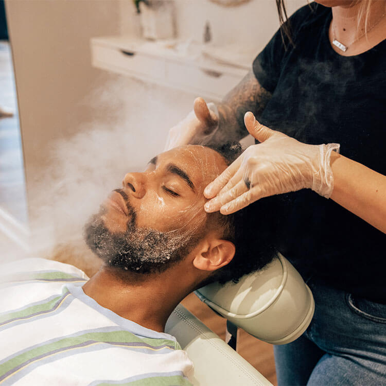 man getting a steam facial