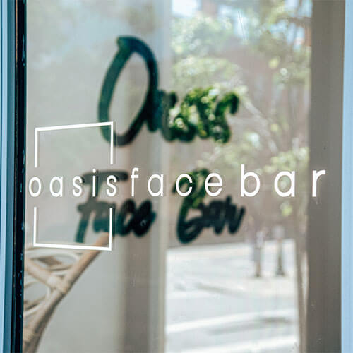 Oasis Face Bar window logo