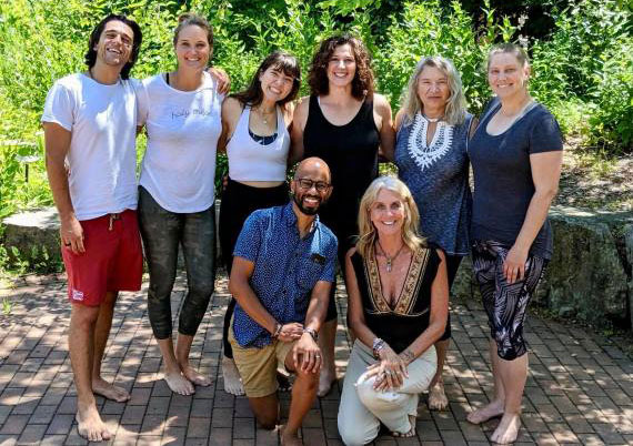 People attending the Perennial Yoga school