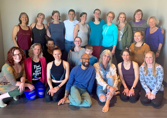students and teachers at the perennial yoga school