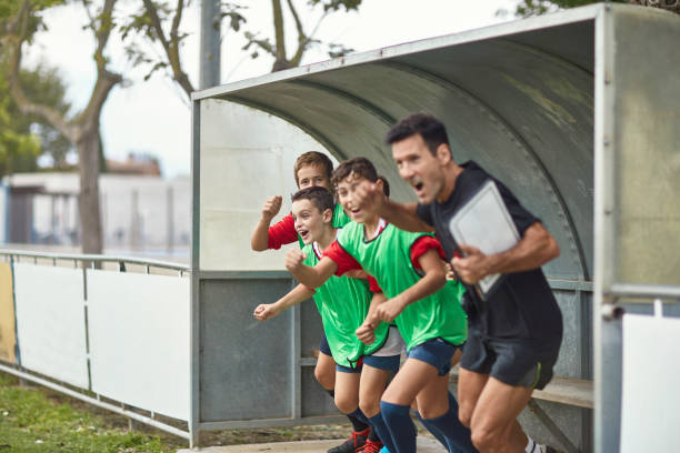 coach with team players cheering