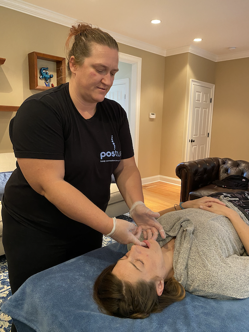 TMJ Mouth Work at Posture Massage by Julie working on a patient laying on a covered table TMJ Mouth Work at Posture Massage by Julie working on a patient laying on a covered table