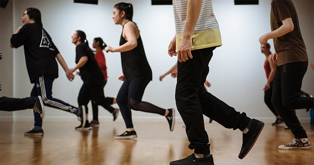 Adults participating in a hip hop dance class for fitness at Pulse Studios