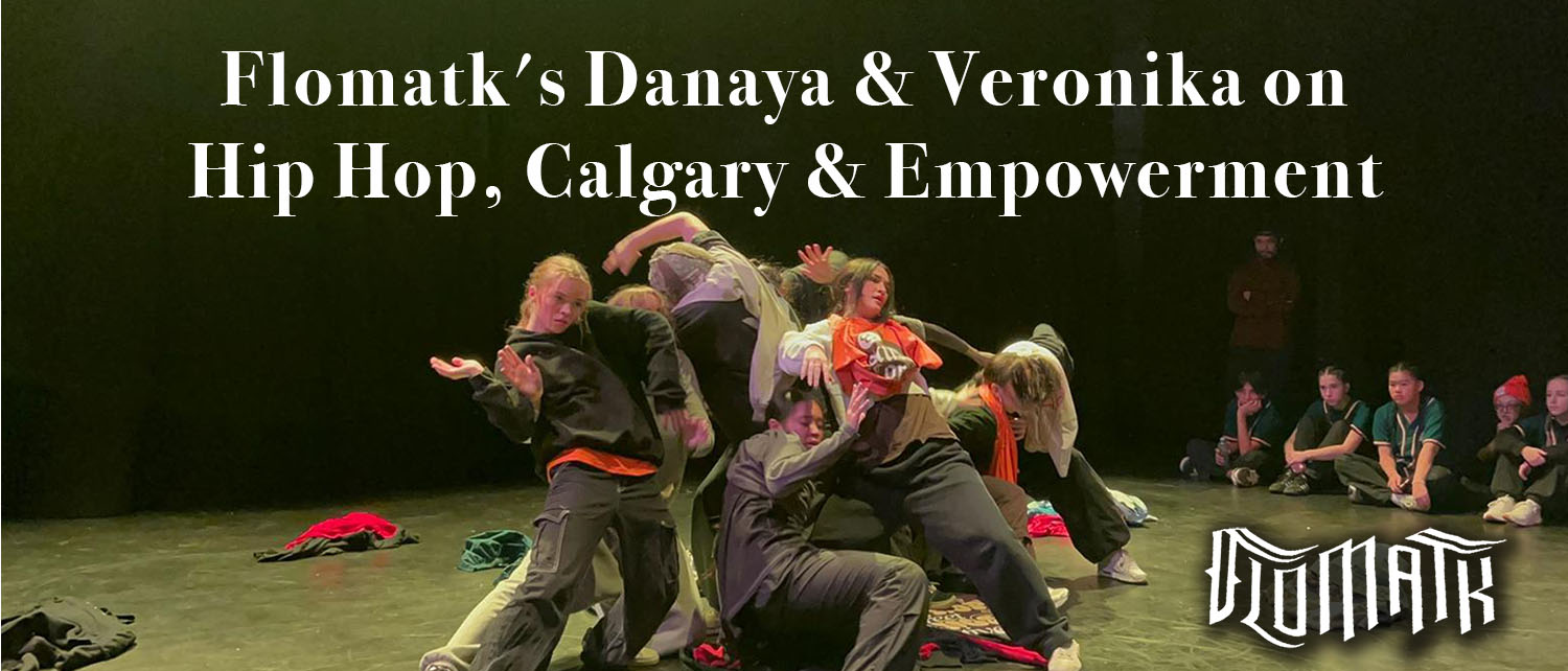 Flomatk dance crew mid-performance on a Calgary stage, embodying empowerment and the energy of Hip Hop culture with an audience watching.